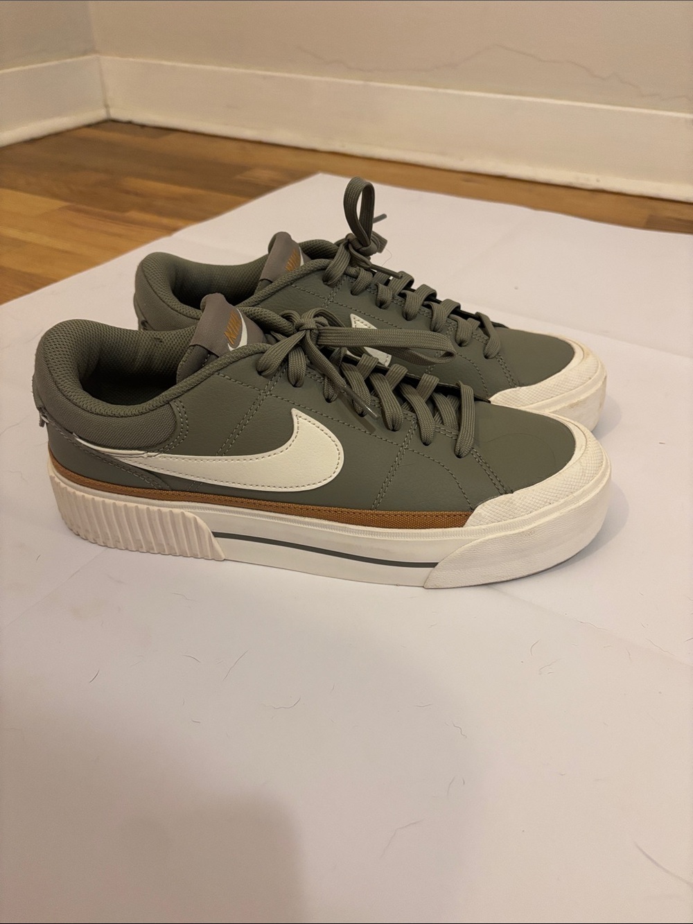 Nike Women’s Low-Top Sneakers in Olive Green with White Swoosh and Brown Accent